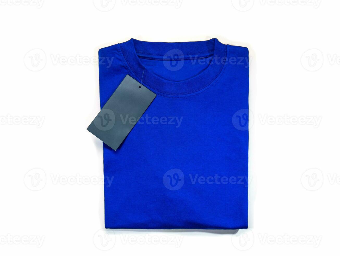 Folded blue T-shirt with a round neck on a white background. photo