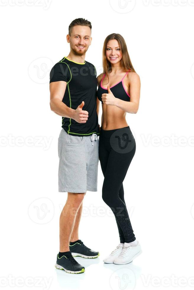 Sport man and woman after fitness exercise with a finger up on the white photo