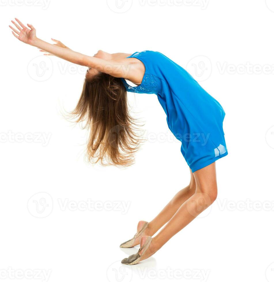 Young girl dancing in a blue dress photo