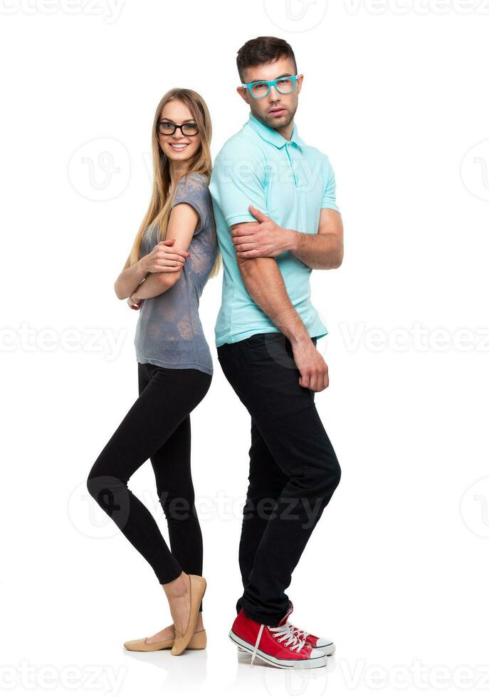 Beautiful young happy couple, man and woman looking at camera, isolated over white background photo