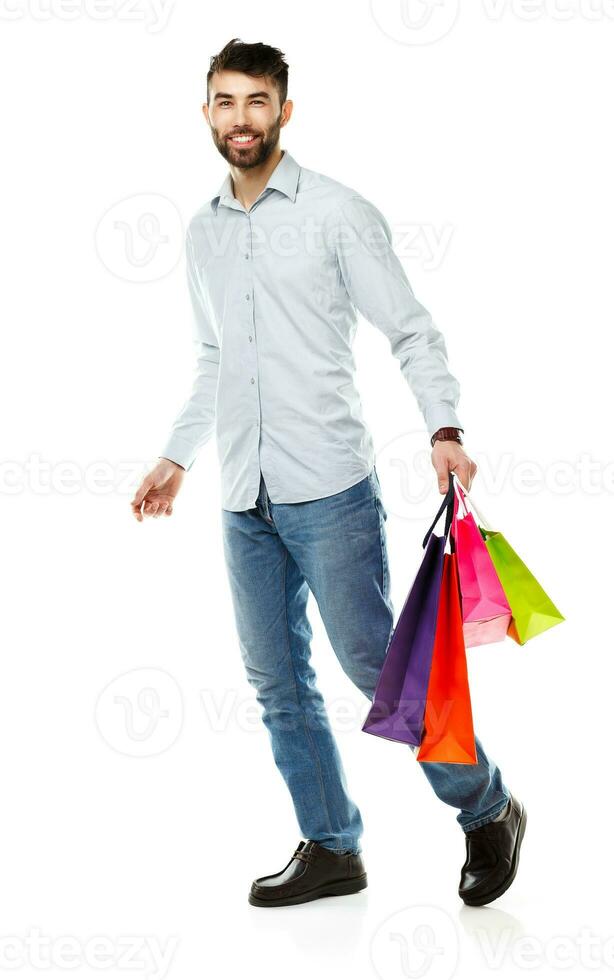 Handsome man holding shopping bags photo