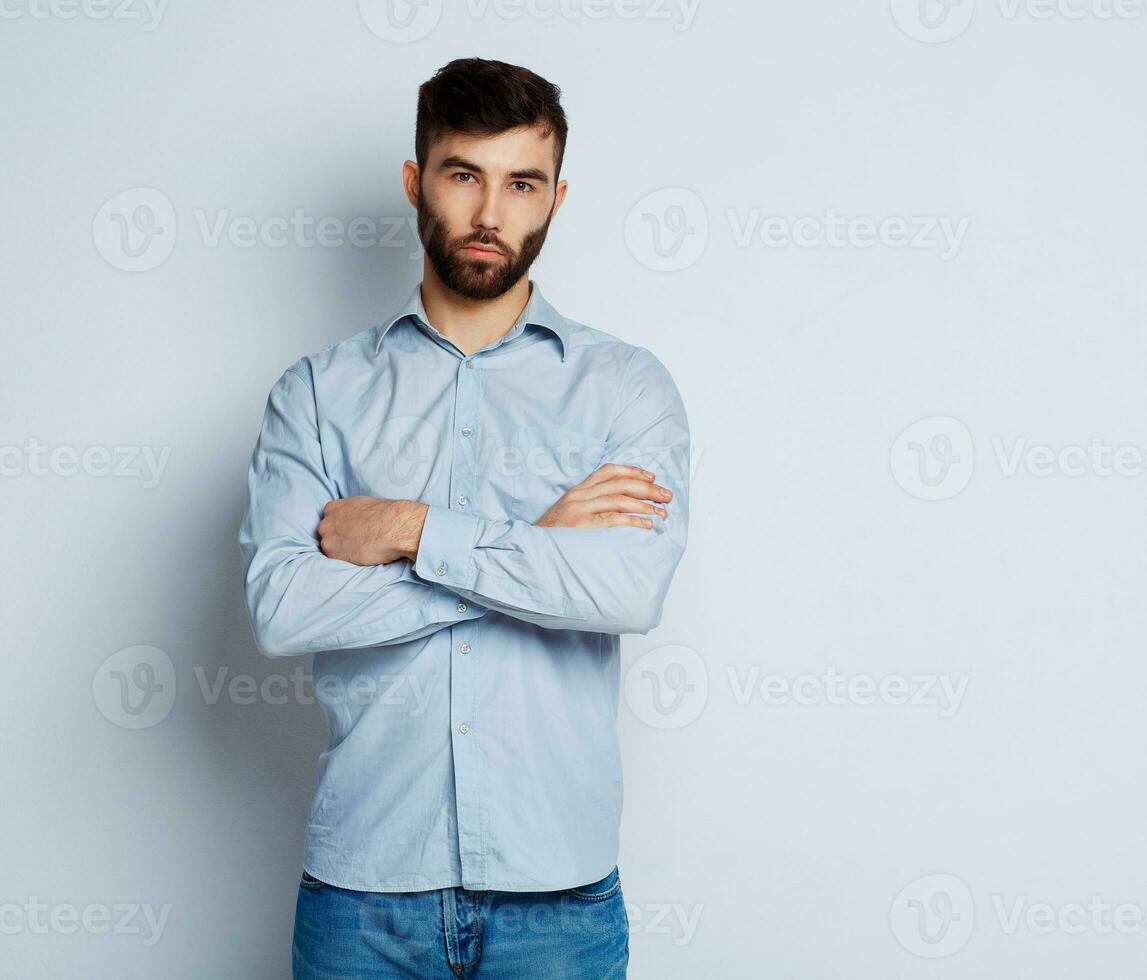 A bearded man with a serious expression on his face photo