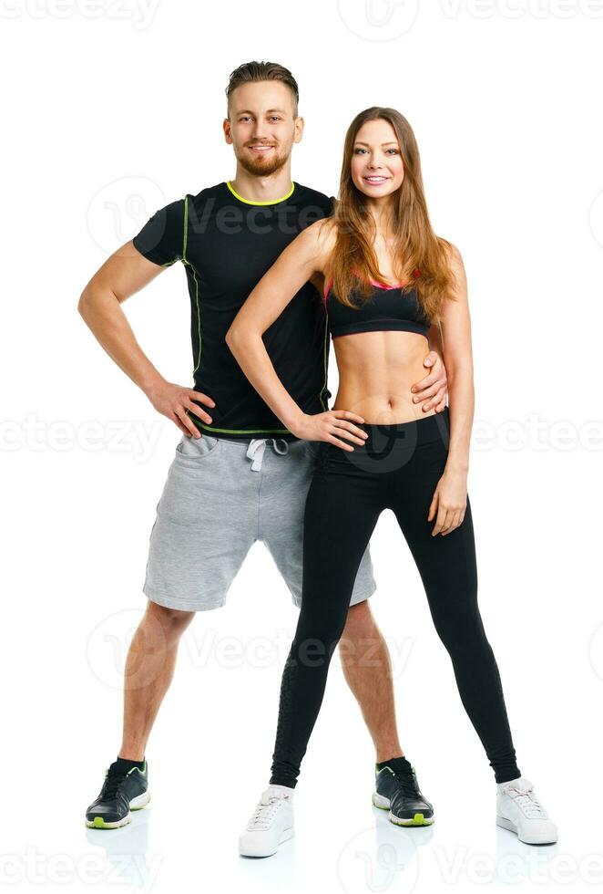 Athletic couple - man and woman after fitness exercise on the white photo