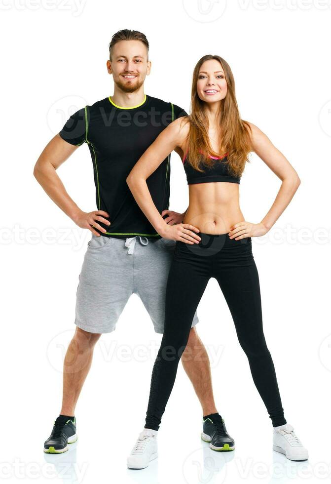 Athletic couple - man and woman after fitness exercise on the white photo