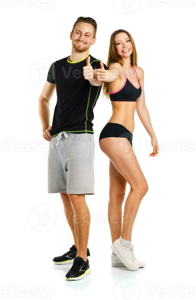Athletic man and woman after fitness exercise with a finger up on the white photo