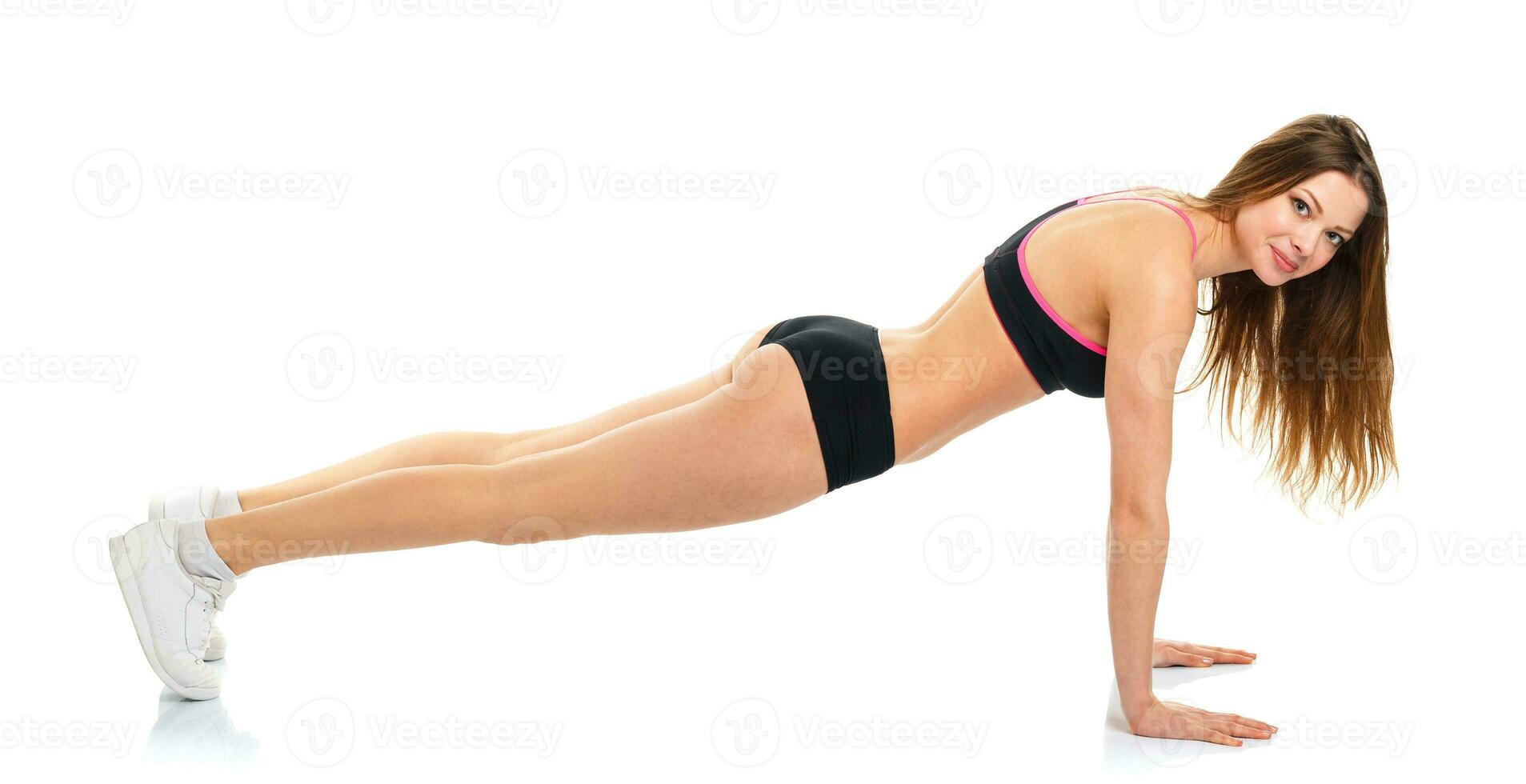 Happy athletic woman doing sport exercise photo