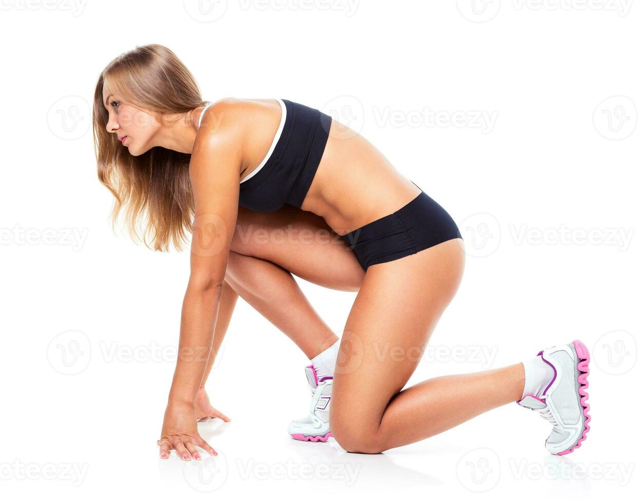 Young athletic girl on white photo