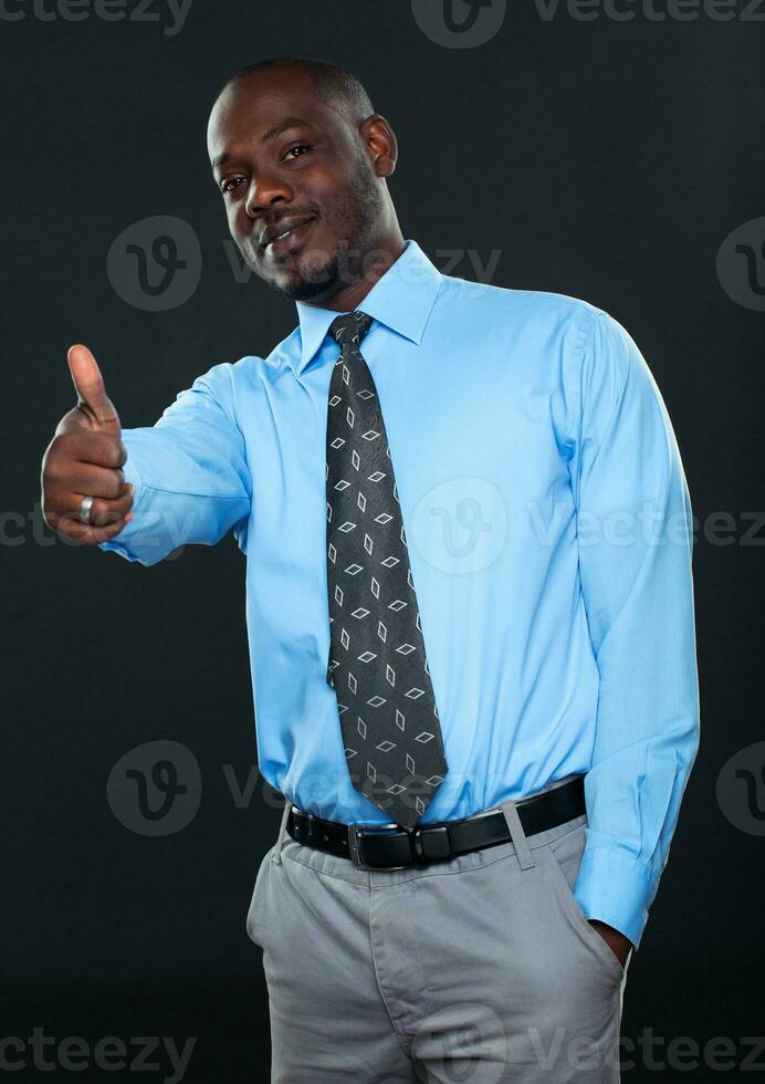 Young successful Businessman Showing Thumb Up photo