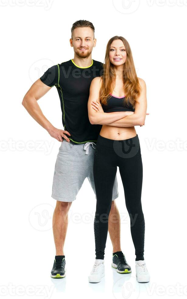Athletic couple - man and woman after fitness exercise on the white photo