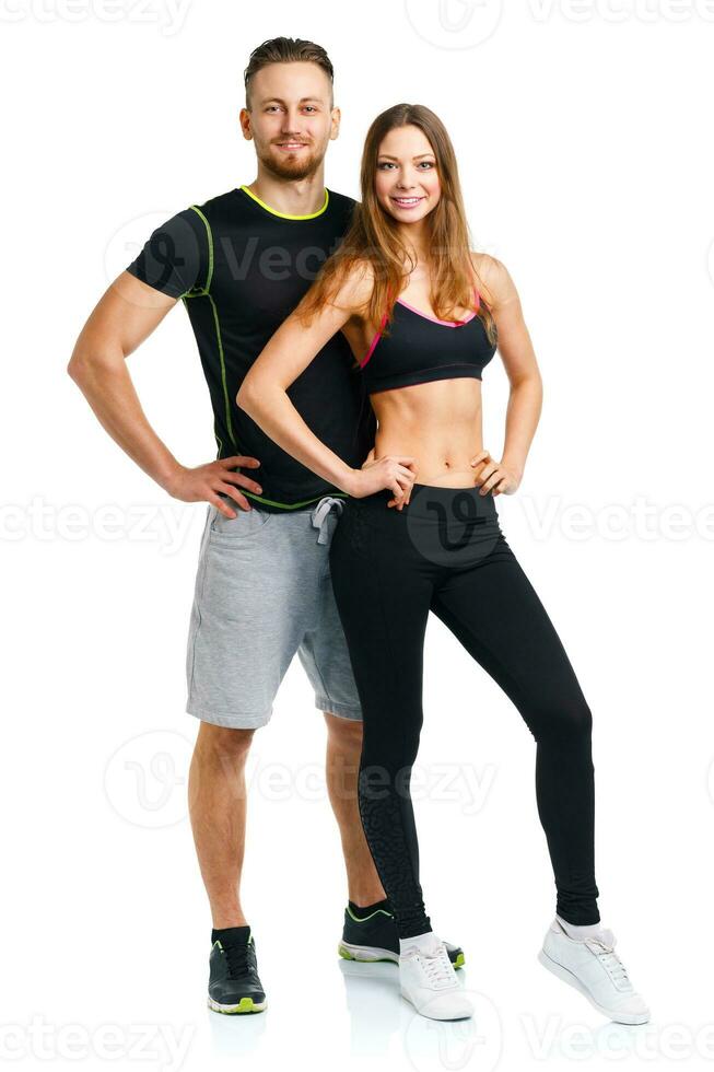 Athletic couple - man and woman after fitness exercise on the white photo