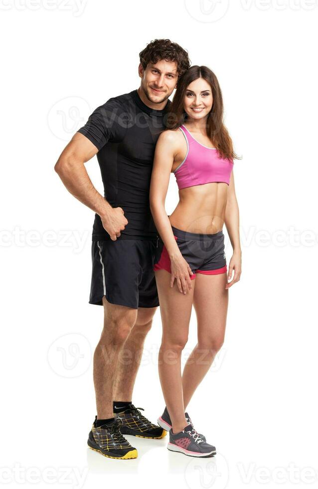 Sport couple - man and woman after fitness exercise on the white photo