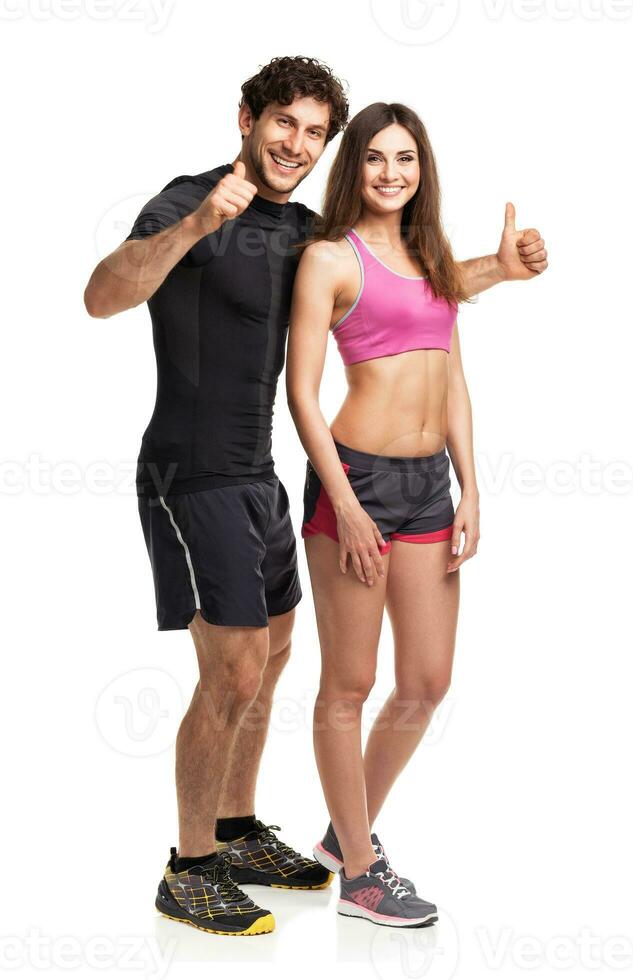 Sport couple - man and woman after fitness exercise on the white photo