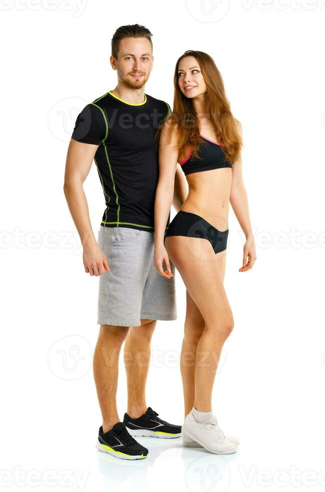 Sport couple - man and woman after fitness exercise on the white photo