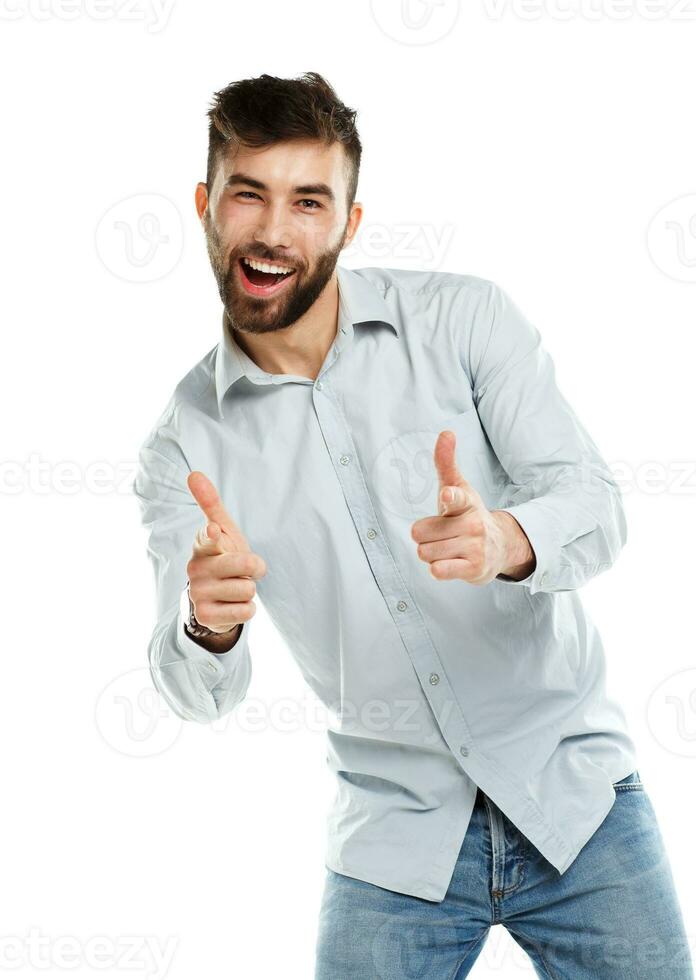 A young bearded man smiling with a fingers up isolated on white photo