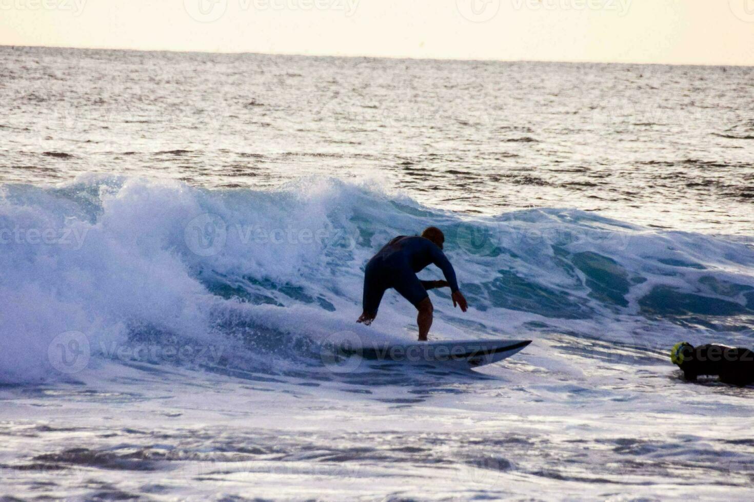 People surfing in the sea photo