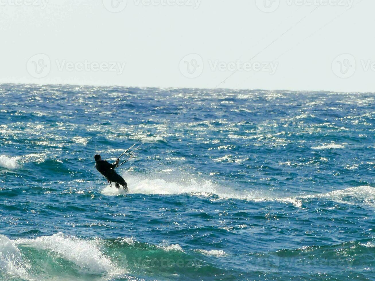A man doing windsurf photo