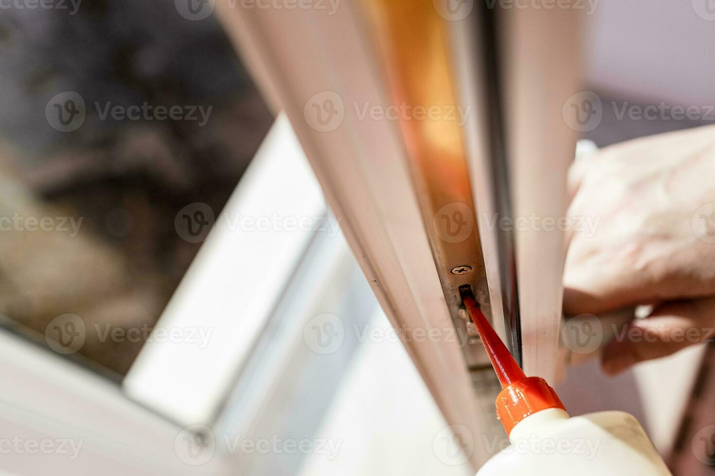 view of lubrication of open window frame close up photo