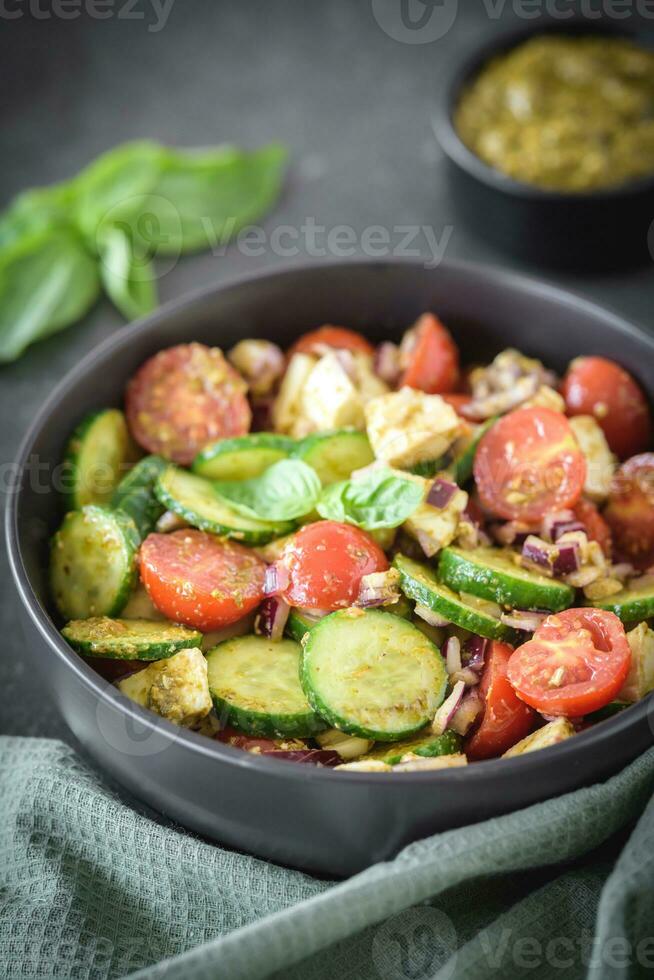 Pesto cucumber tomato salad 23276779 Stock Photo at Vecteezy