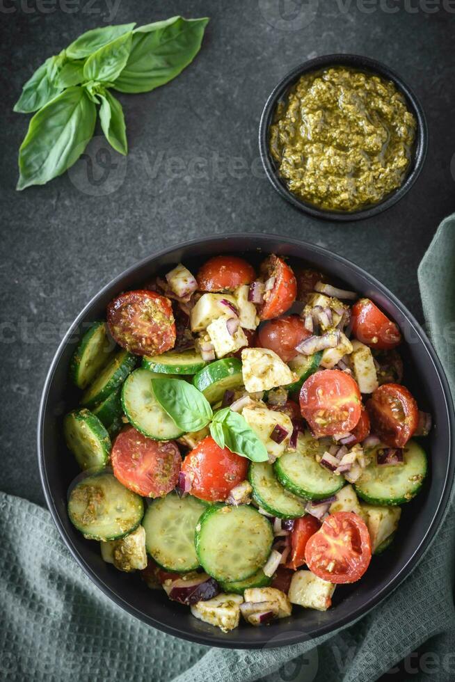 Pesto cucumber tomato salad 23277623 Stock Photo at Vecteezy