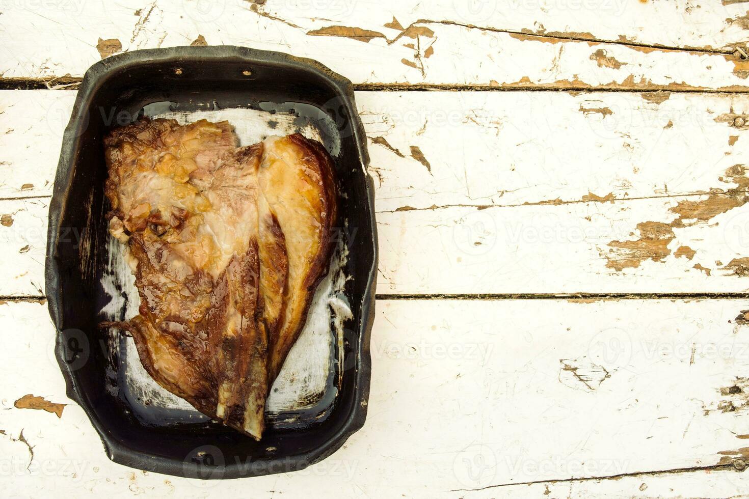 Pork meat in pan photo