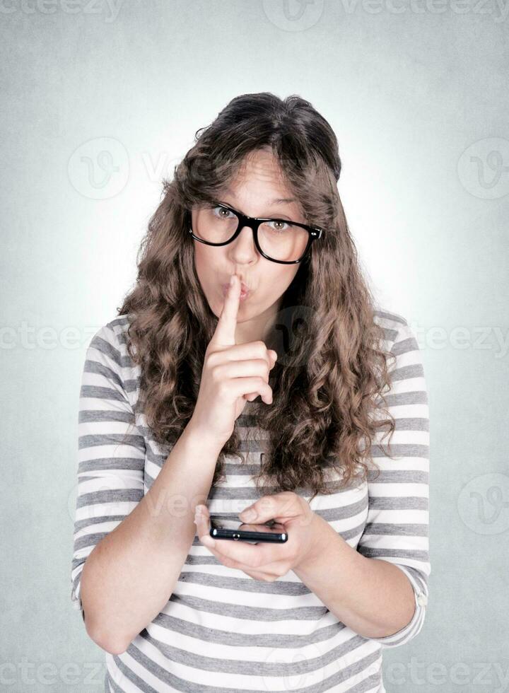 Woman making Silence sign photo