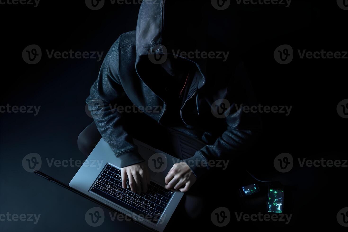 Internet hacker sitting at personal computer laptop tablet photo