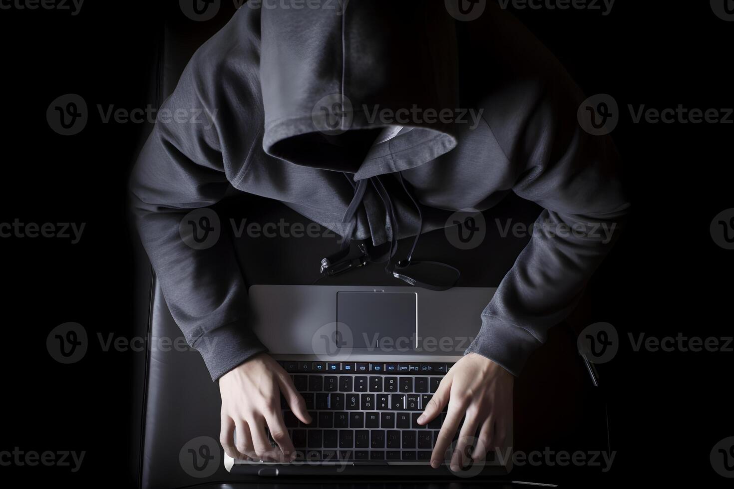 Internet hacker sitting at personal computer laptop tablet photo