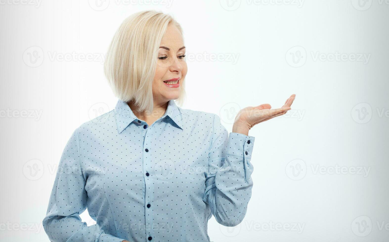 Business lady hold open hand new product open palm empty space sales manager wear specs shirt isolated white background photo