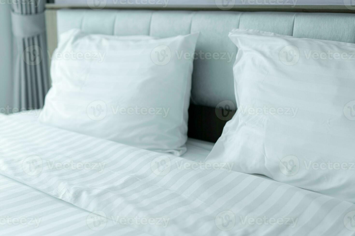 Clean Bedding sheets and pillow at hotel for traveler photo