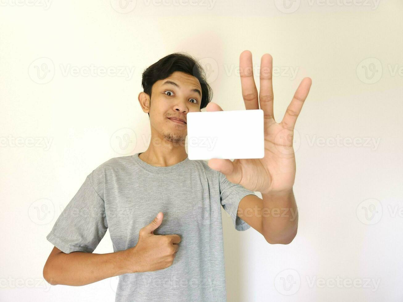 man showing close up empty card to focus on the card. photo