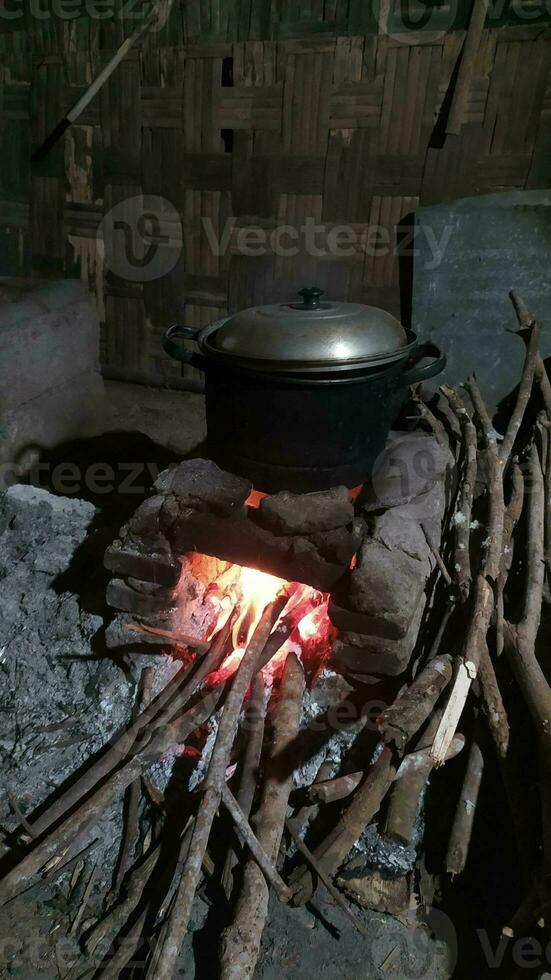 Traditional rural stove for cooking using firewood photo