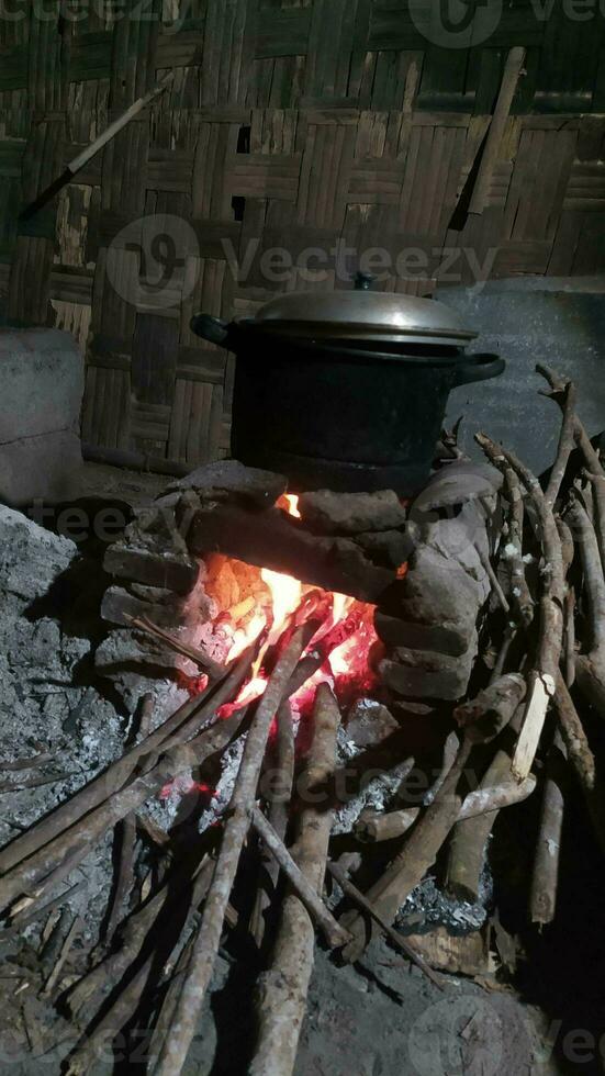 Traditional rural stove for cooking using firewood photo