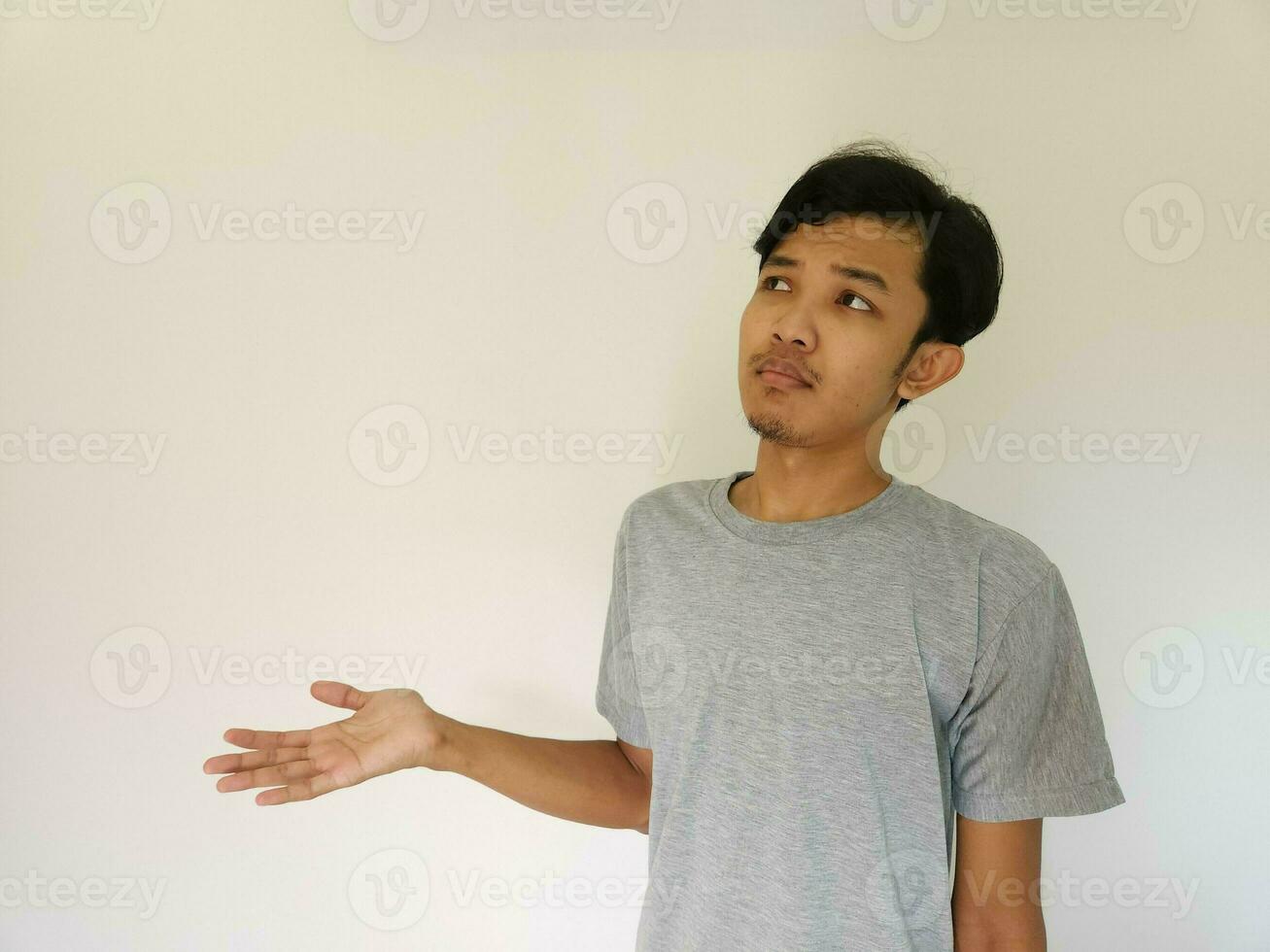 Worries face expression of Asian man who got problem isolated on white photo