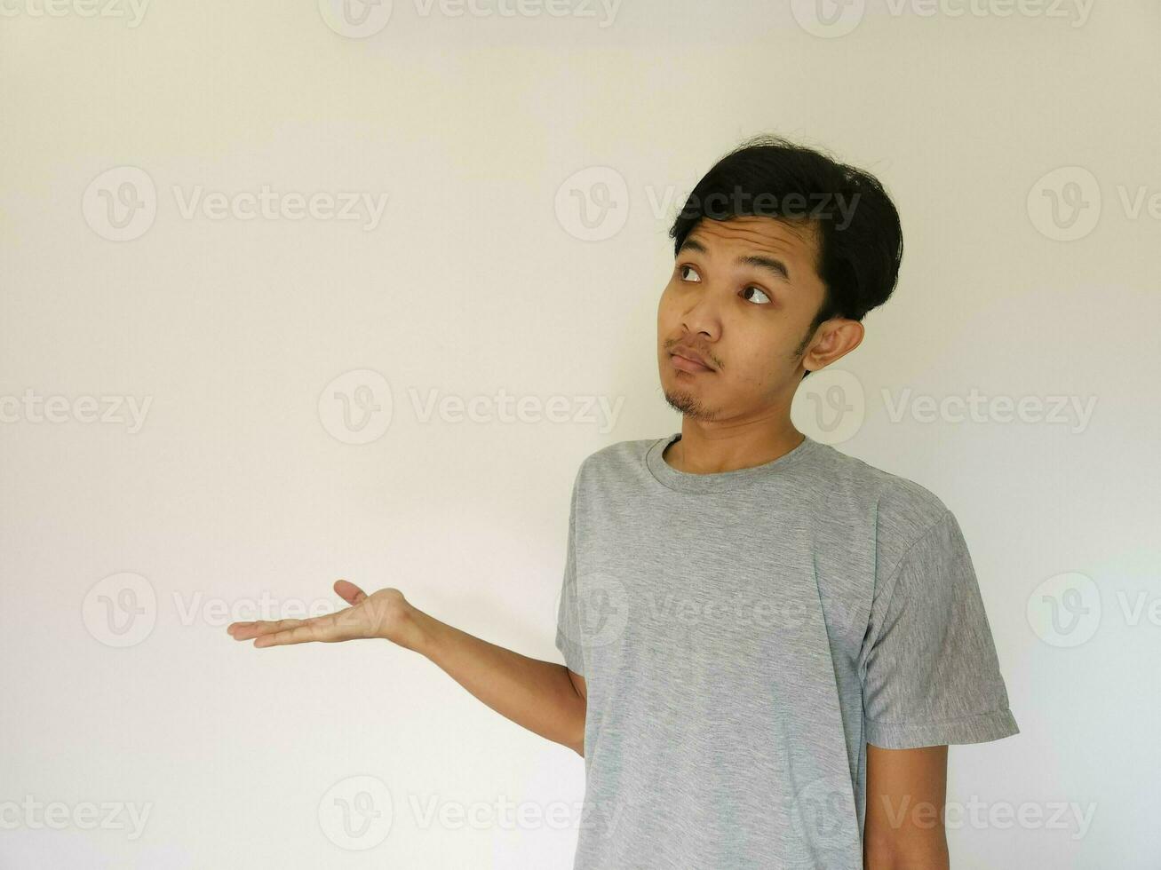 Worries face expression of Asian man who got problem isolated on white photo