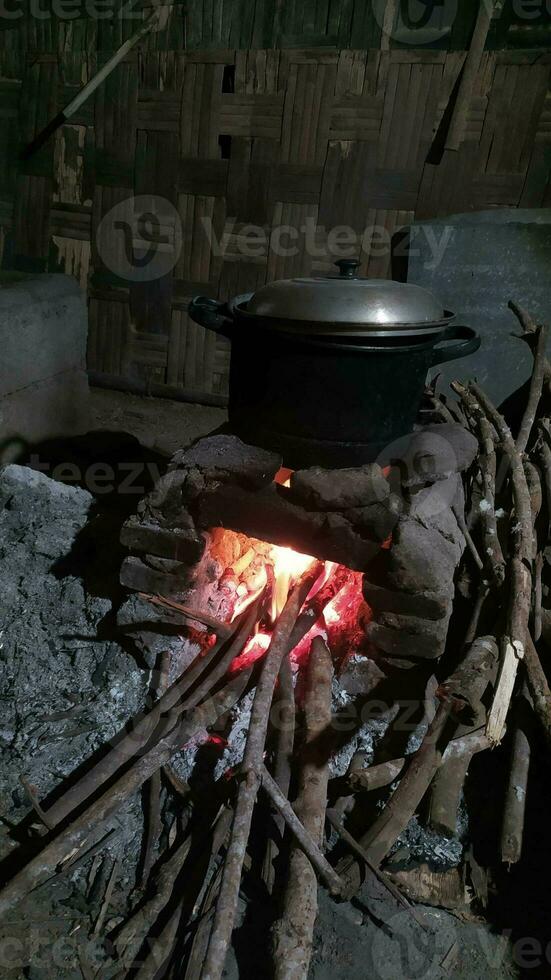 Traditional rural stove for cooking using firewood photo