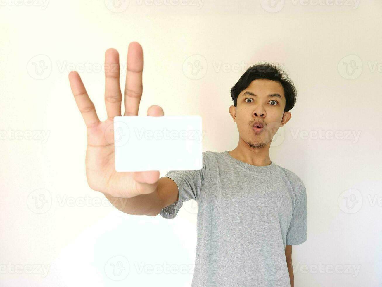 man showing close up empty card to focus on the card. photo