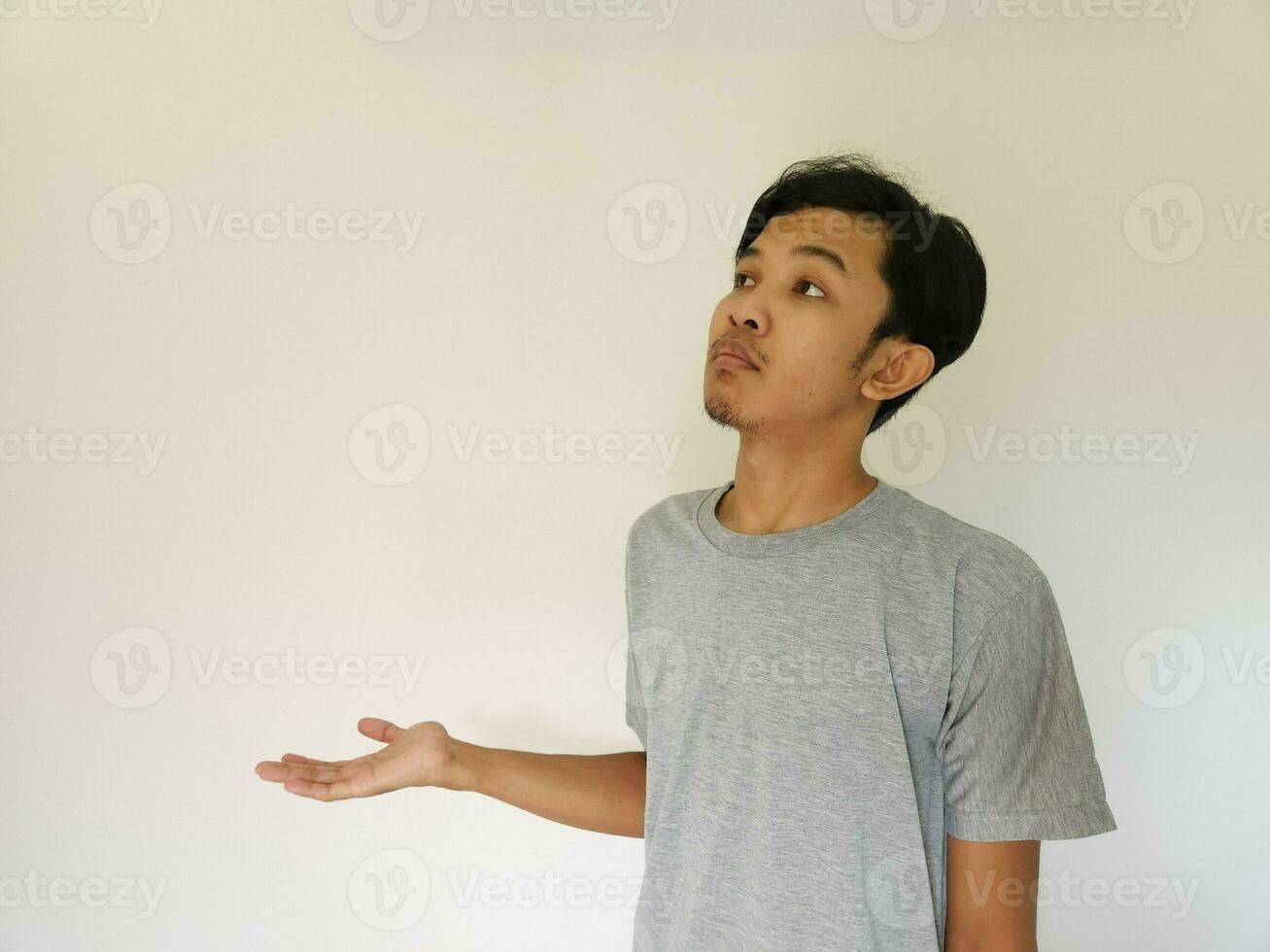 Worries face expression of Asian man who got problem isolated on white photo