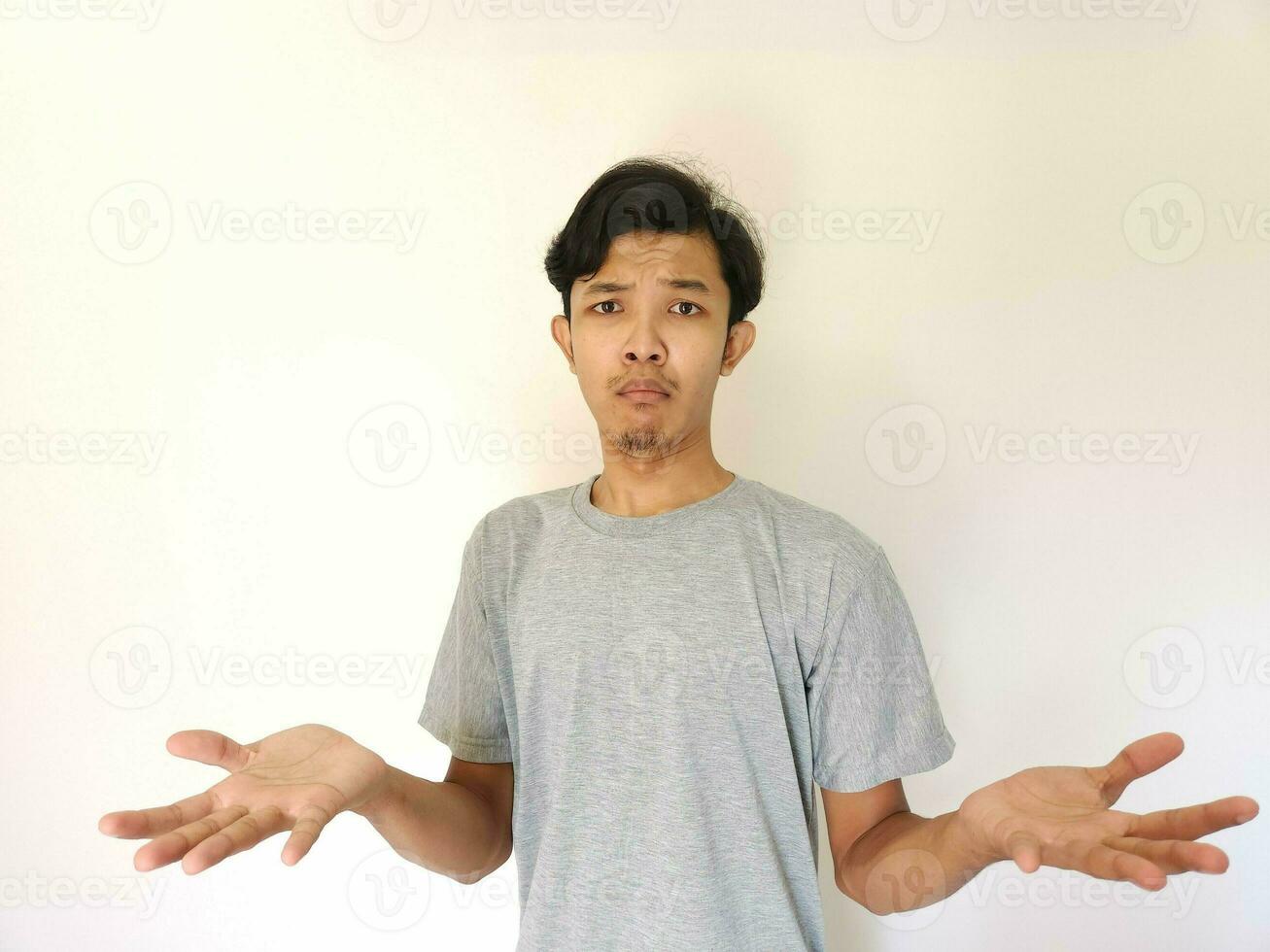 Worries face expression of Asian man who got problem isolated on white photo