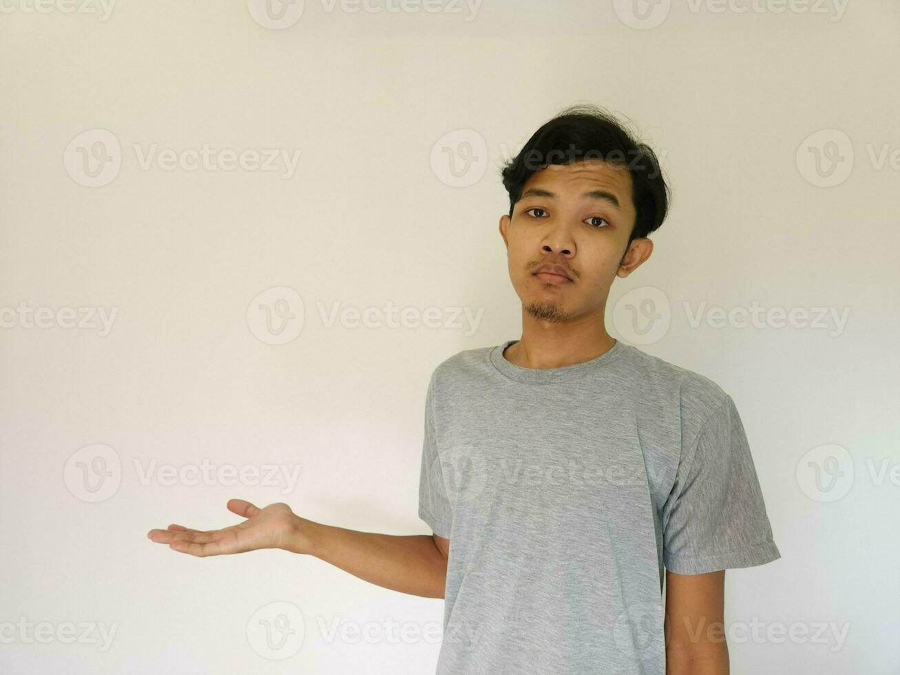 Worries face expression of Asian man who got problem isolated on white photo