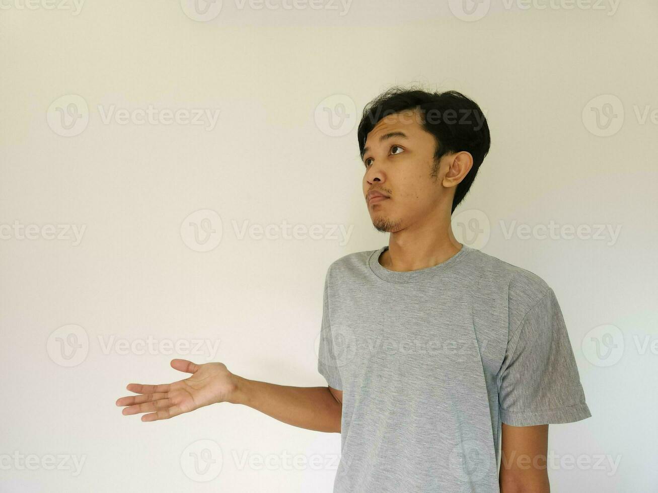 Worries face expression of Asian man who got problem isolated on white photo