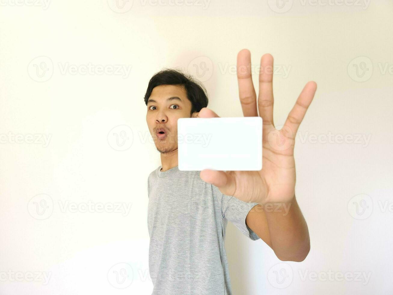 man showing close up empty card to focus on the card. photo