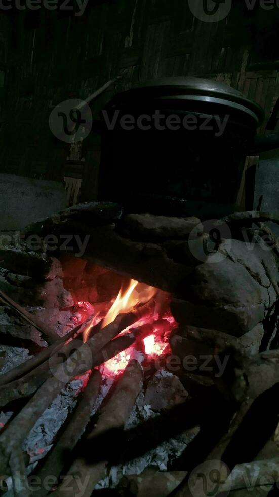 Traditional rural stove for cooking using firewood photo