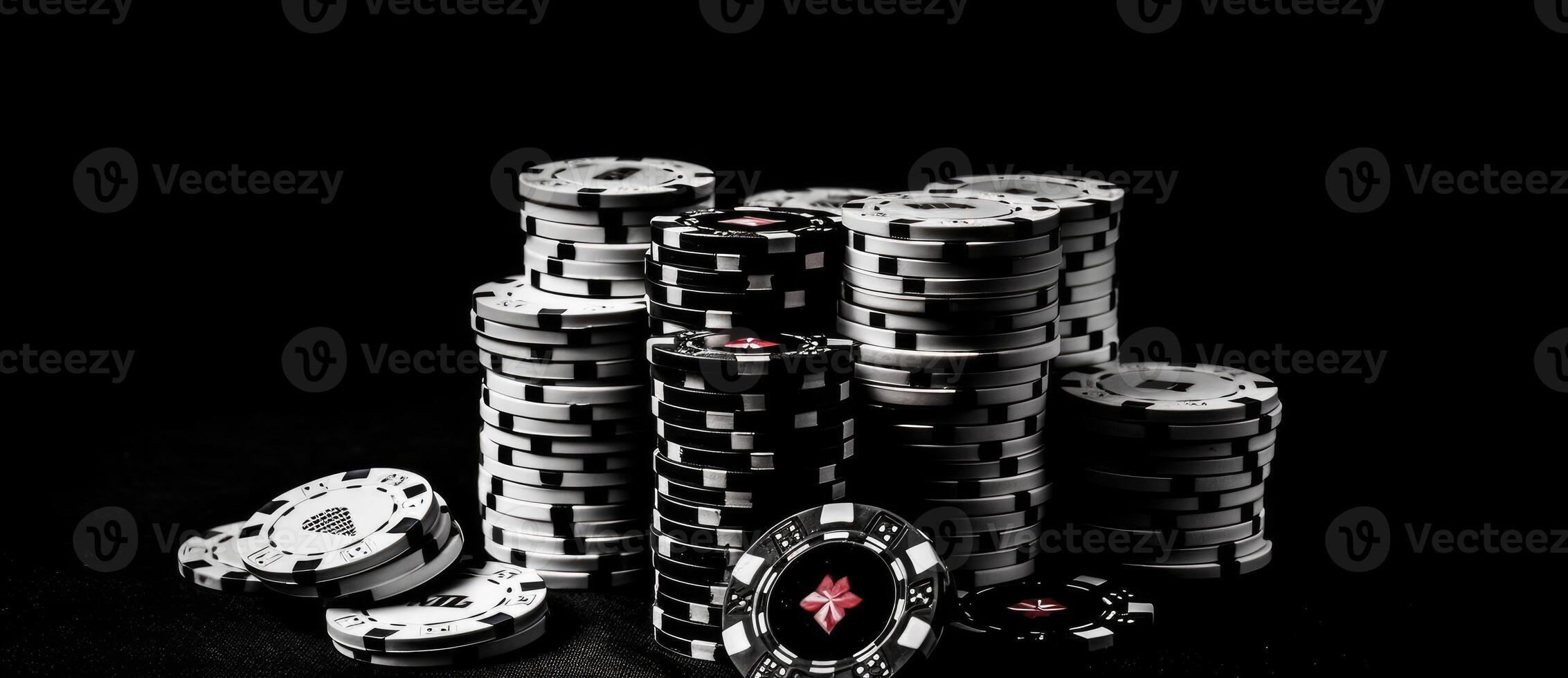 Casino chips on the black background with casino cards. photo