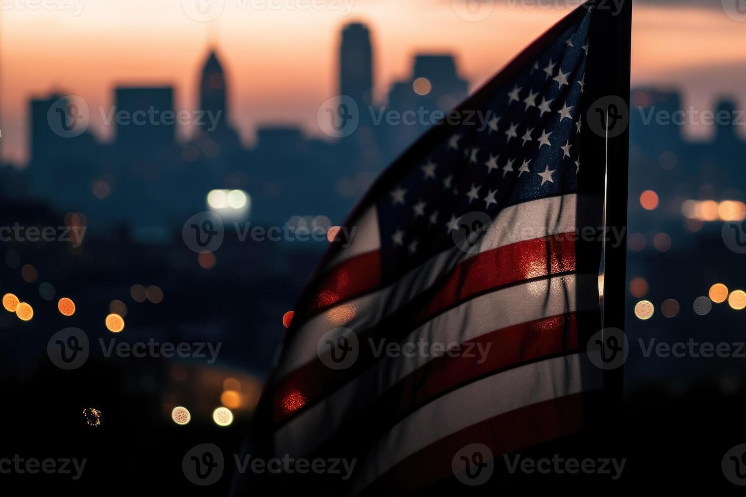 Photo of american flag in front of bokeh effect of cityscape in background.