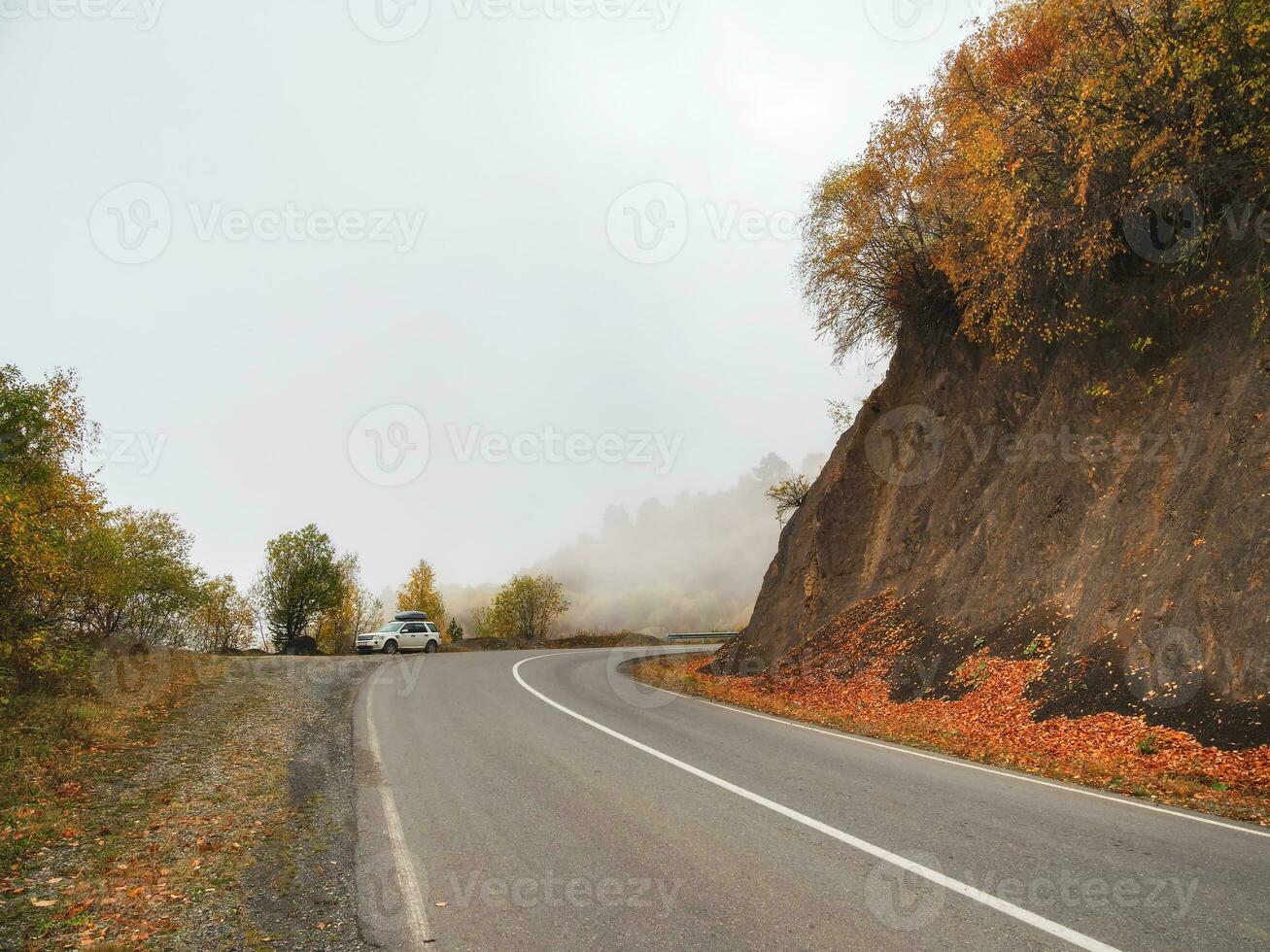 High Alpine road. Beautiful autumn high-mountain highway with dangerous twisting turns. photo