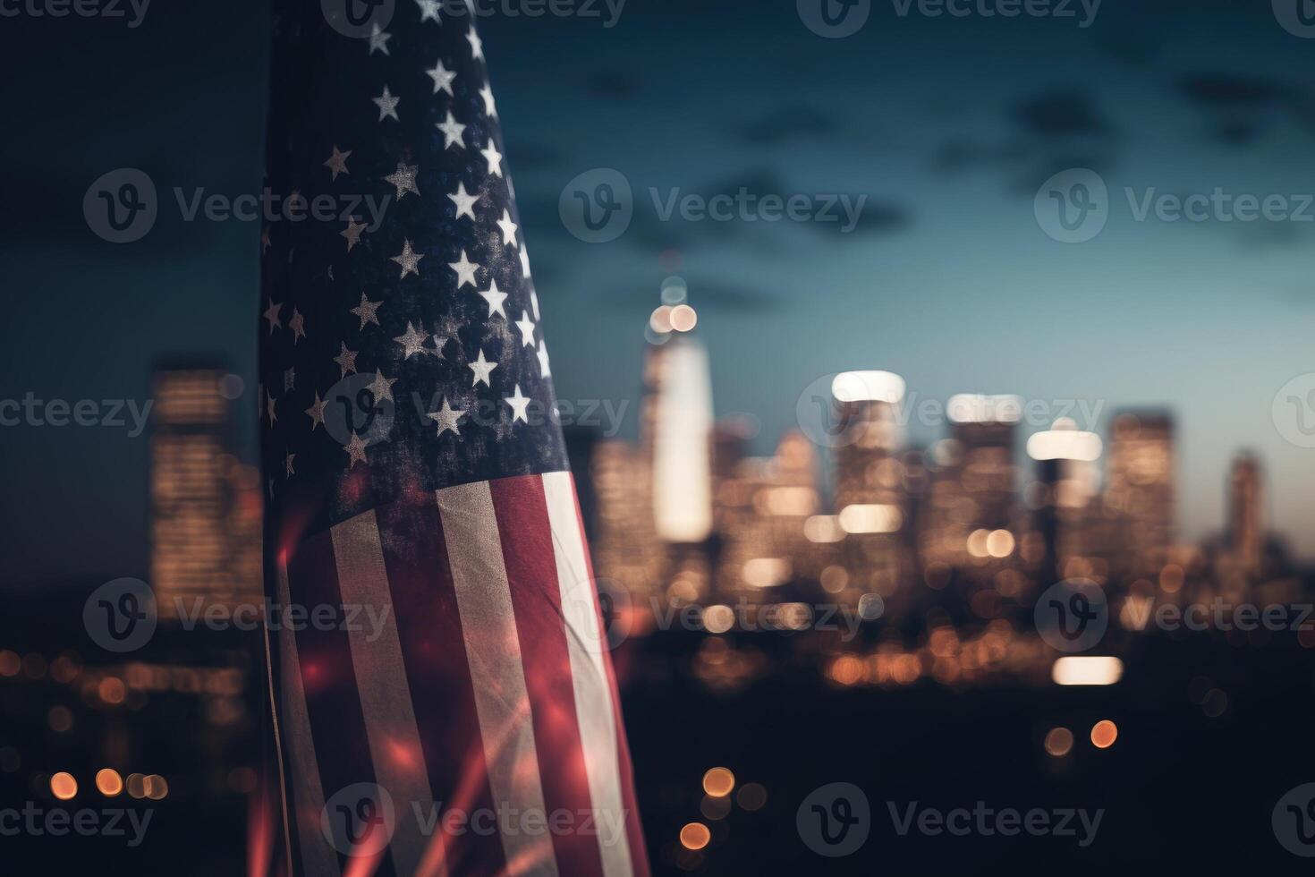 Photo of american flag in front of bokeh effect of cityscape in background.