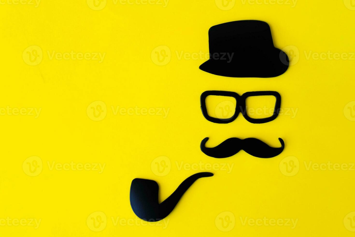 Happy fathers day sticker, hat, glasses, black mustache, and smoking pipe on a yellow background. Hipster objects. Father's day is a holiday photo