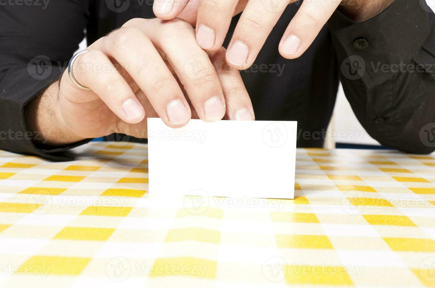 Blank card in the hand photo