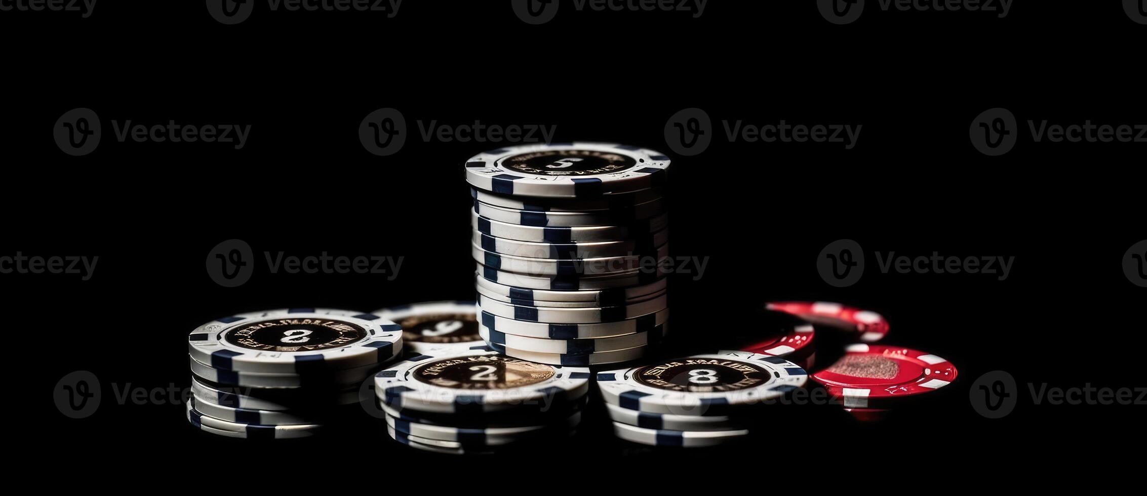 Casino chips on the black background with casino cards. photo