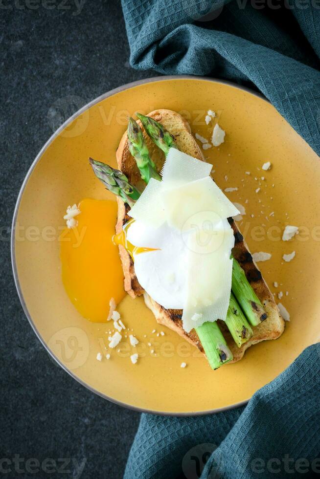 asparagus and poached egg on toast 23298248 Stock Photo at Vecteezy